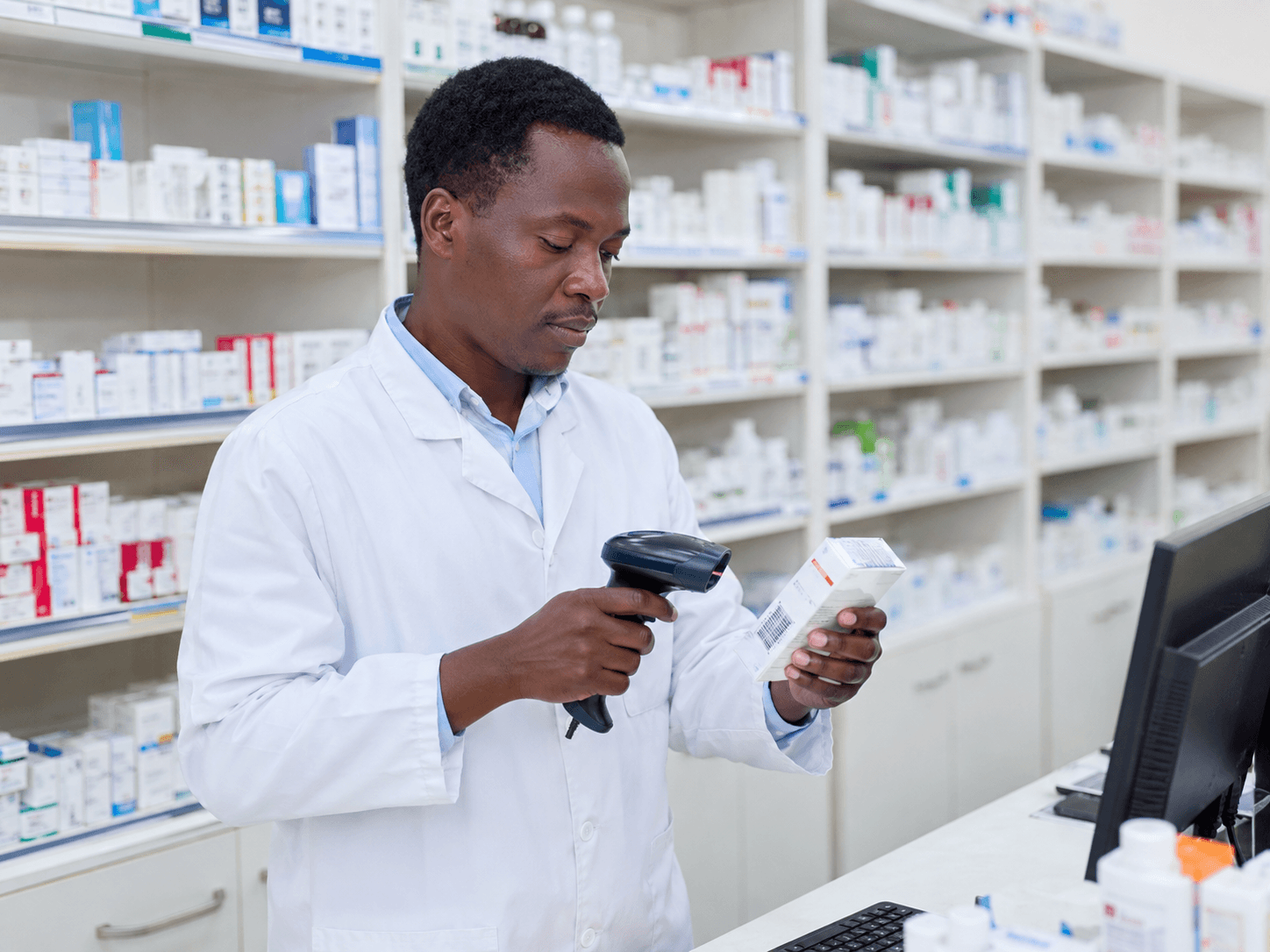 Pharmacist scanning a drug pack